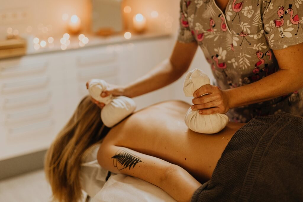 Enjoy a soothing spa experience with a relaxing massage using herbal compresses for ultimate relaxation.